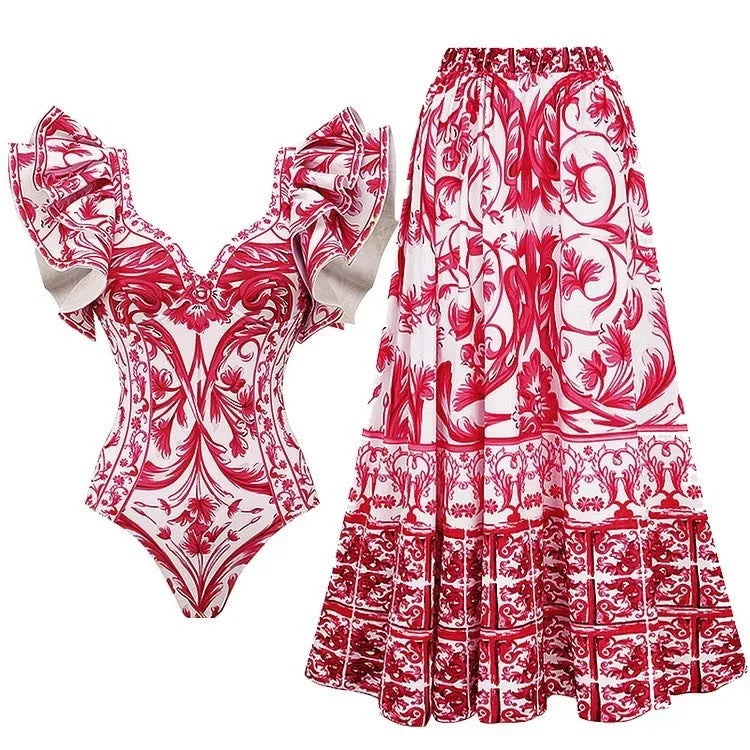 Women's printed one-piece swimsuit with skirt in blue, shown on a model.