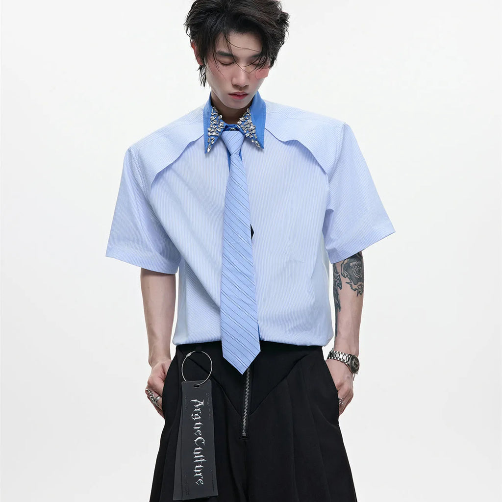 Man's blue patchwork striped shirt with a diamond tie front, quilted panels, and button decorations.