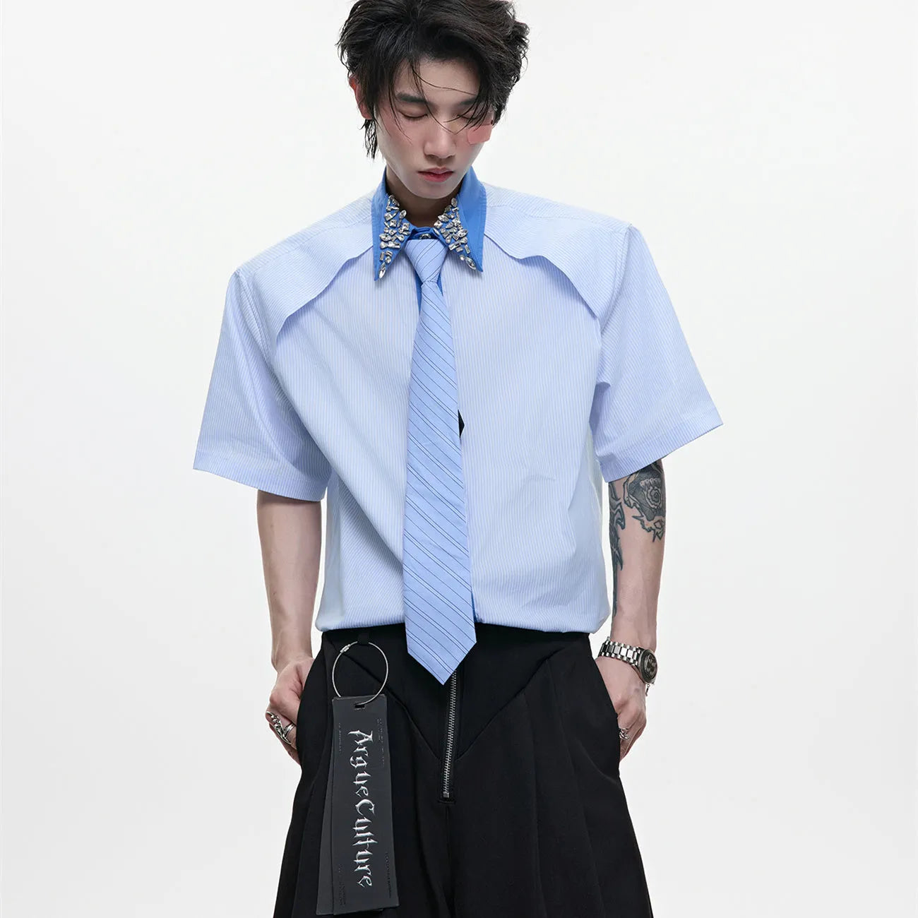 Man's blue patchwork striped shirt with a diamond tie front, quilted panels, and button decorations.