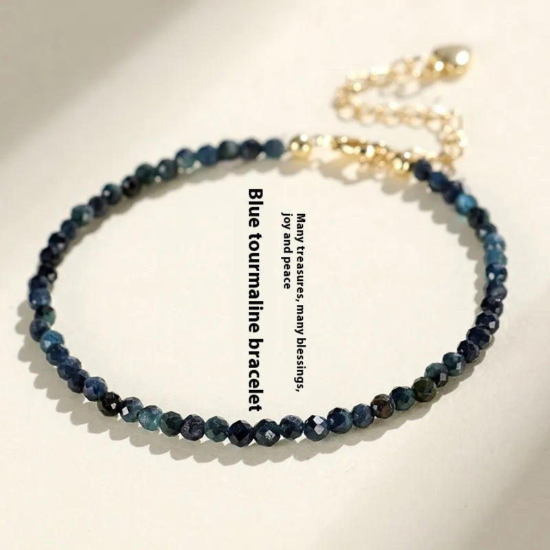 Women's blue tourmaline bracelet with 3mm beads and spacer design