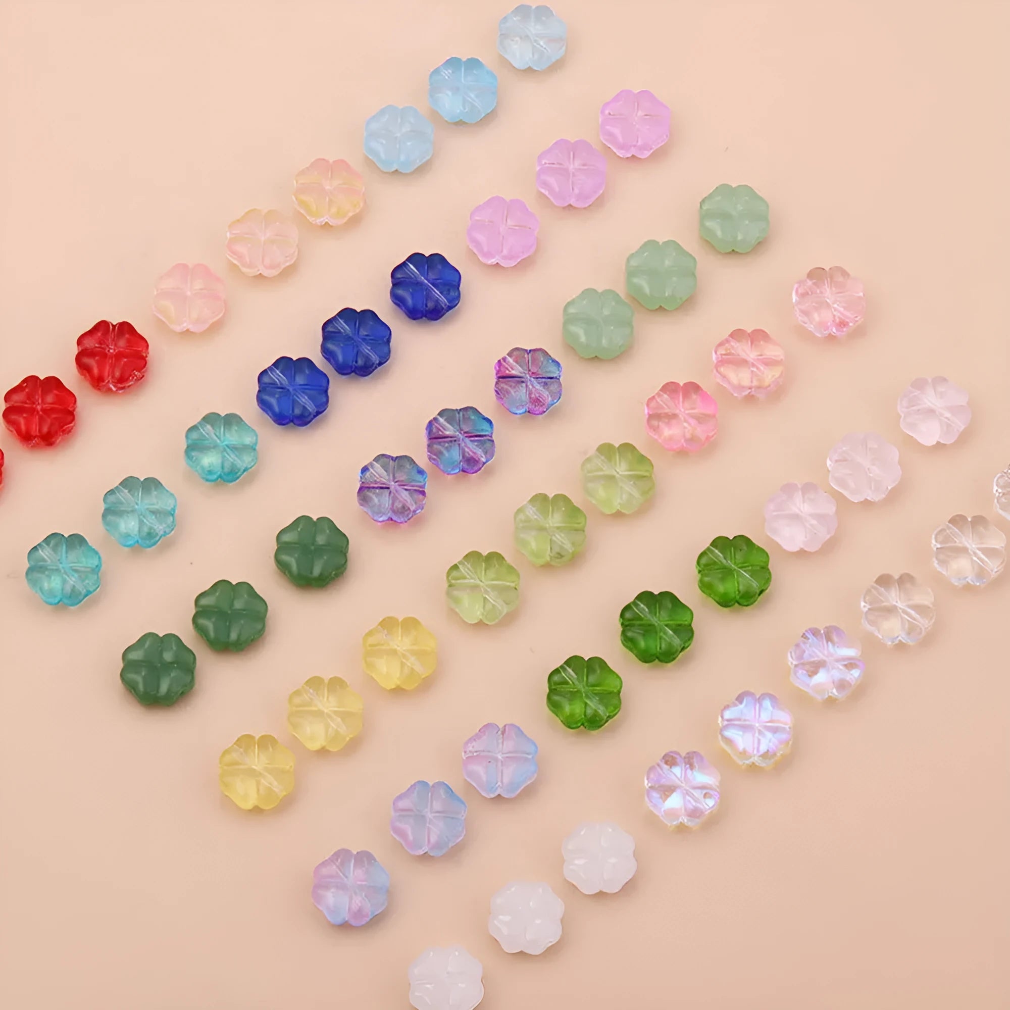 50 glass four-leaf clover beads in assorted colours with coloured glaze finish and 10mm straight hole design.