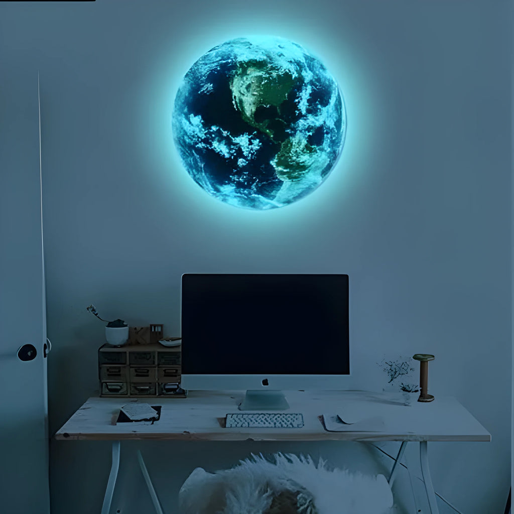 Glow in the dark 3D planet Earth wall sticker on a dark blue background, showing its luminous effect.