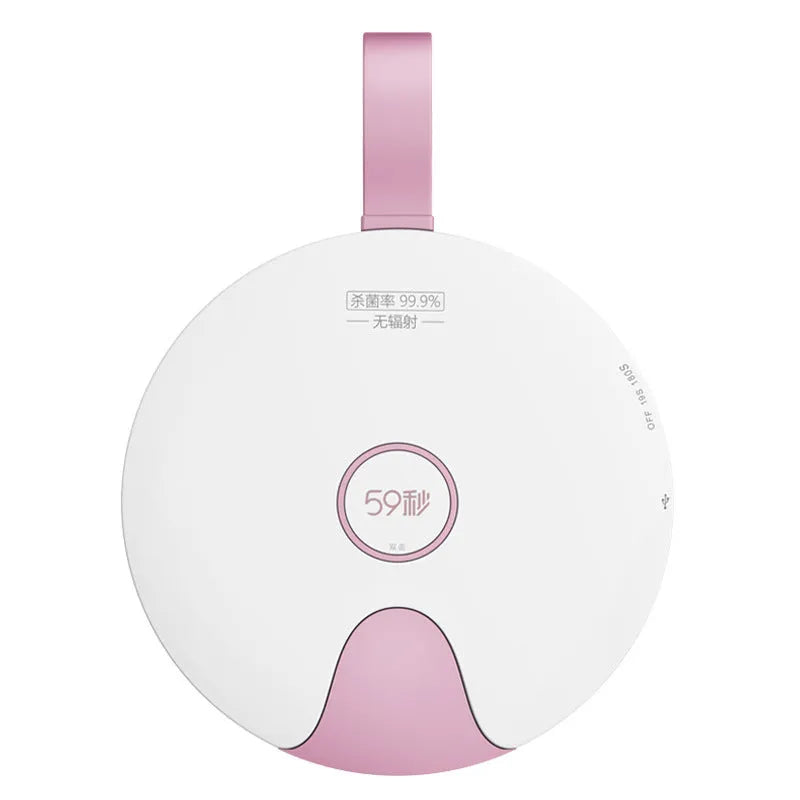 Portable UV baby bottle steriliser in blue or pink, showing compact size and USB port.