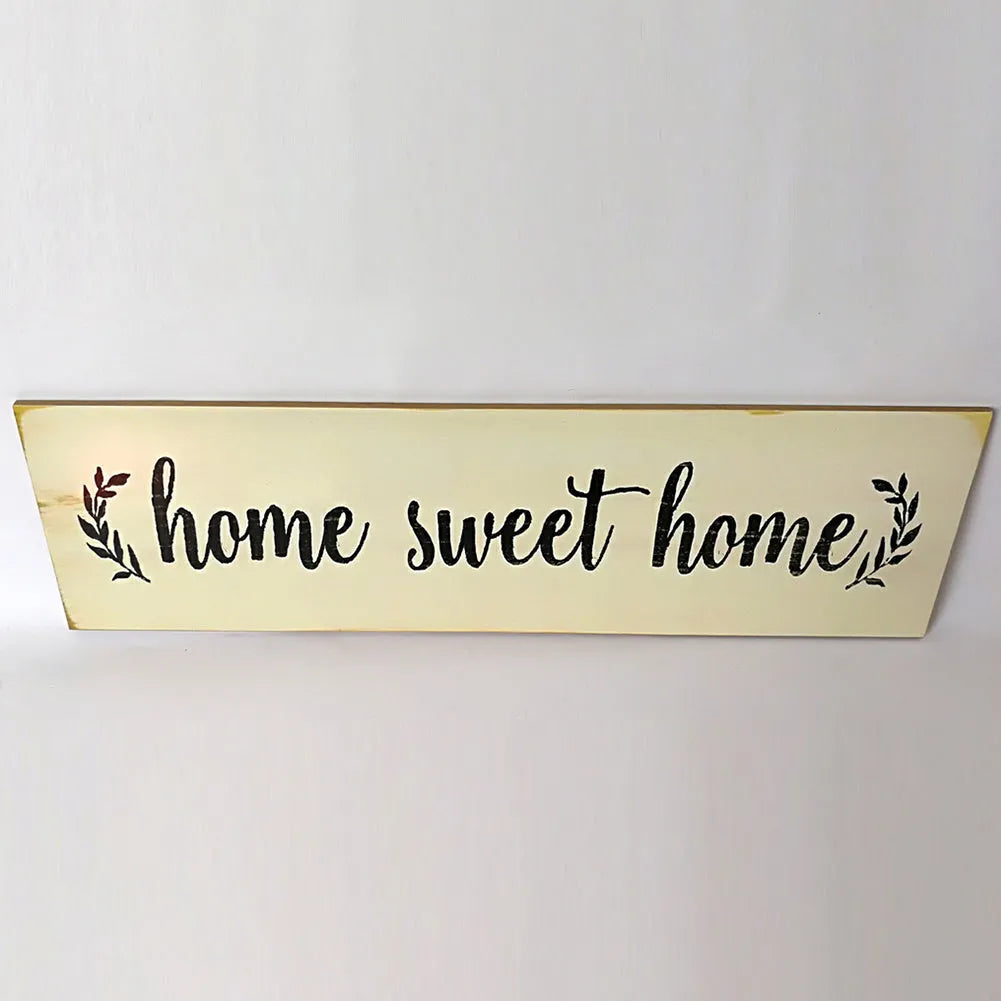 Carved wooden wall pendant decoration measuring 40cm long in black or white colour option