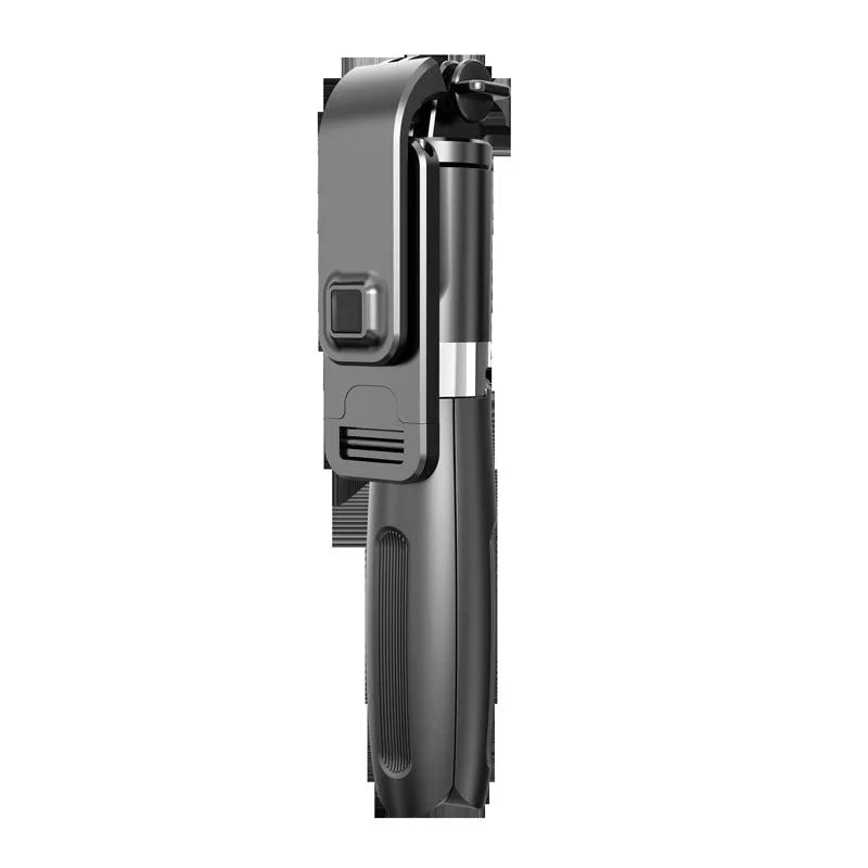 Extended black Bluetooth selfie stick with phone attached, showing remote control and folded tripod legs.