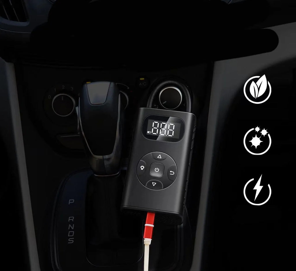 Black M09X portable power bank tyre inflator with 16cm tube next to car and motorcycle tyres