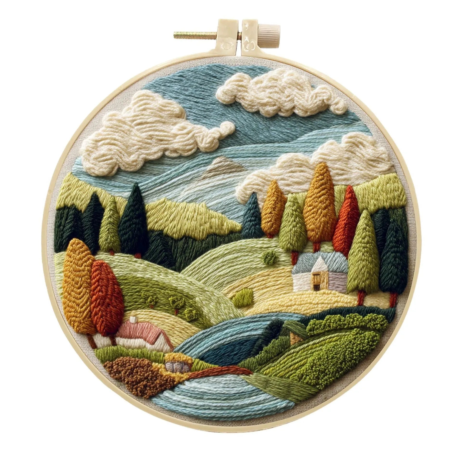 Embroidery DIY kit with bamboo frame, cotton fabric printed with a landscape scene, threads, and needles laid out