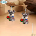 Pair of flat cartoon Schnauzer dog earrings made of acrylic in a Christmas style on white background