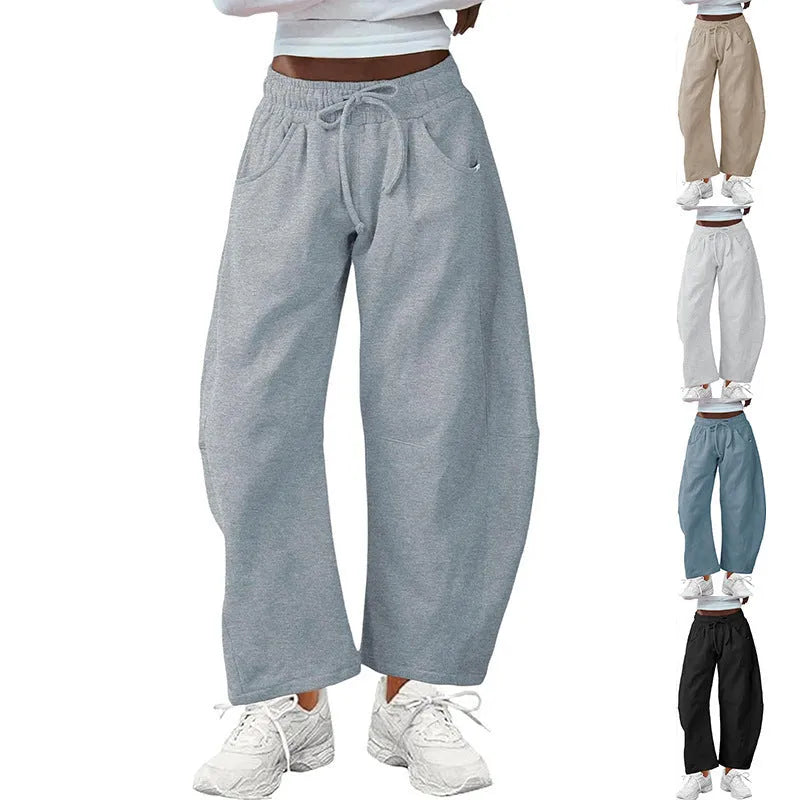 Women's loose cropped sweatpants with drawstring elastic waist and side pockets in street fashion style