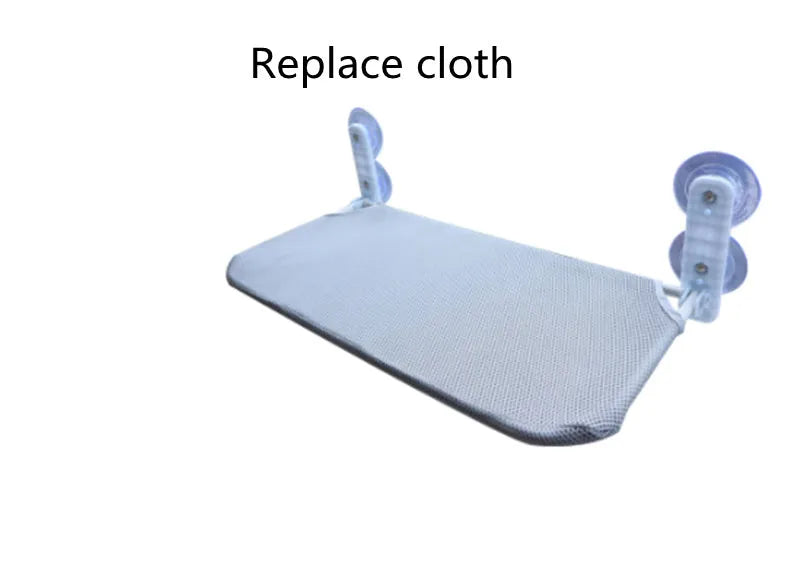 Grey plush cat window hammock with stainless steel suction cups mounted on a glass pane