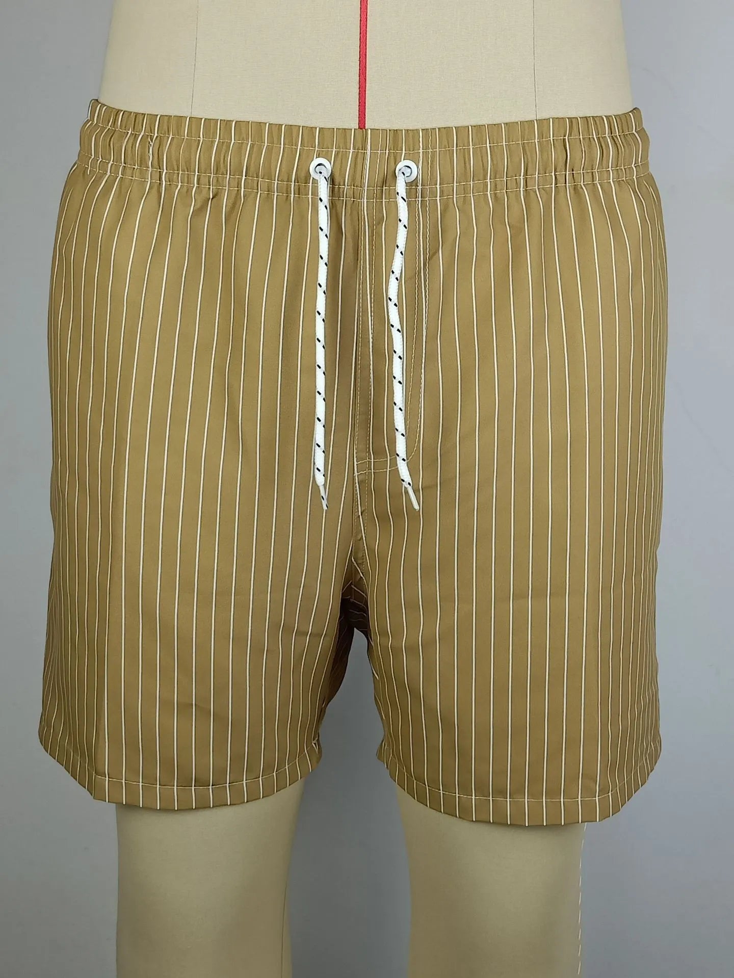 Men's striped polyester beach shorts in light blue with straight leg cut