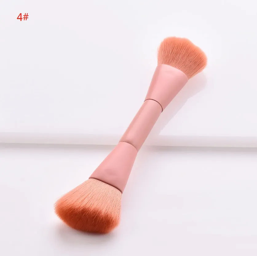 Ten professional makeup brushes with wooden handles arranged by size for different cosmetic applications