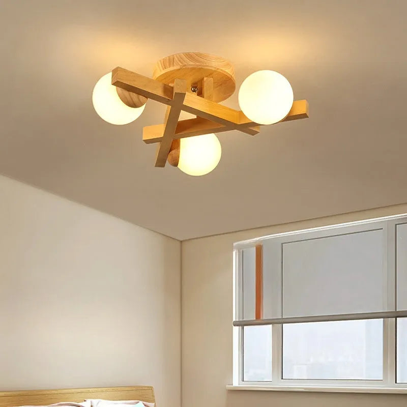 Modern wooden finish ceiling light with three adjustable lamp heads in a neutral white colour.