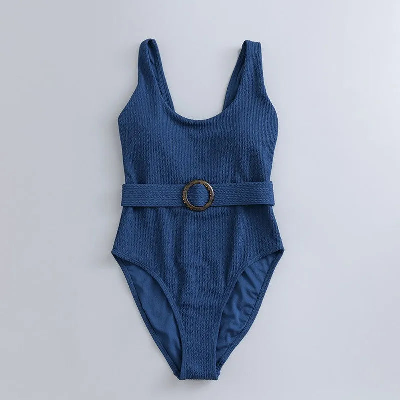 Navy blue women's one-piece swimsuit with slimming triangle design and built-in chest pad