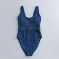 Navy blue women's one-piece swimsuit with slimming triangle design and built-in chest pad