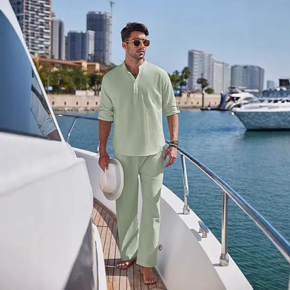 Men's solid colour cotton casual suit with long sleeves and trousers on a hanger.