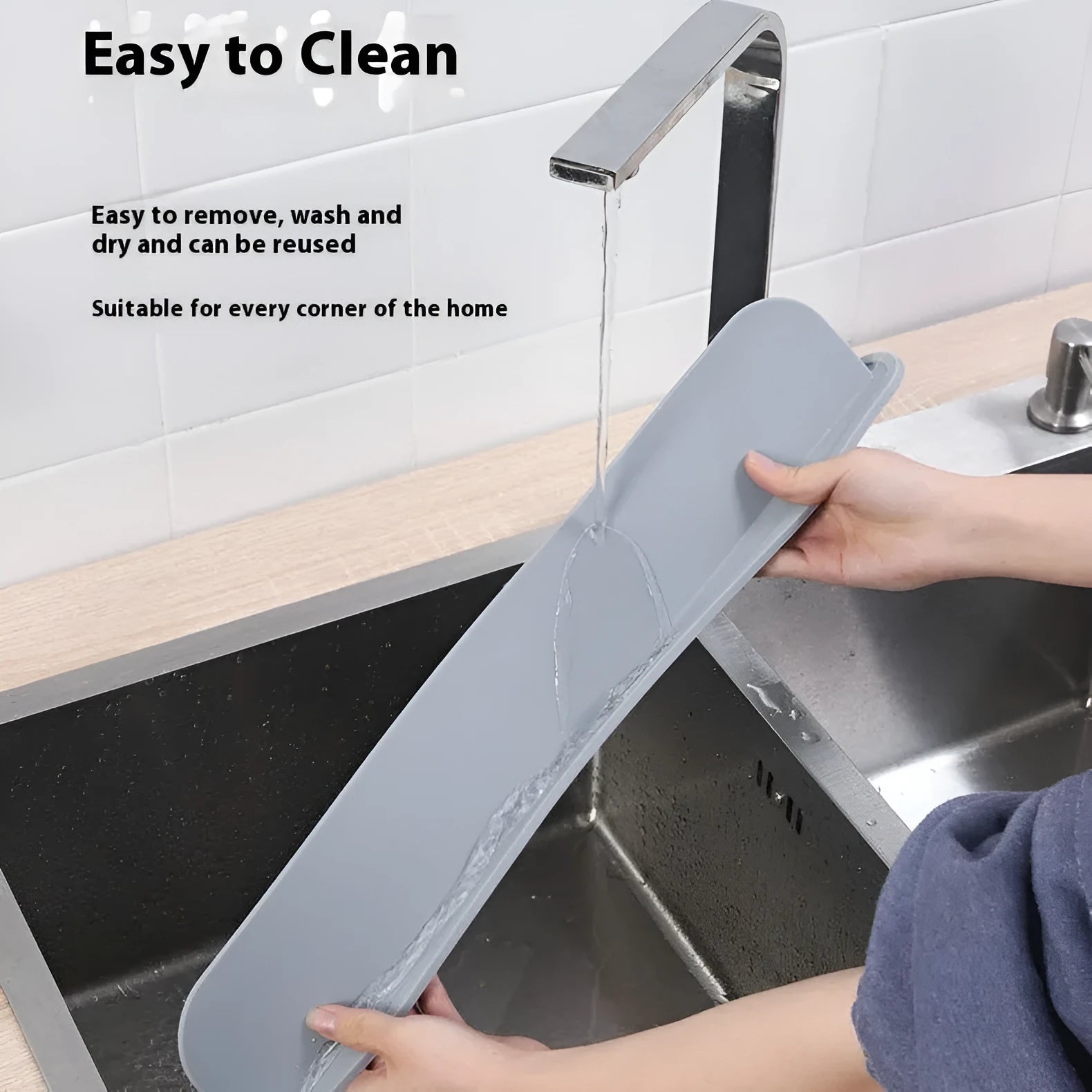 A thick grey silicone kitchen sink water blocking plate or splash guard measuring 52mm by 85mm.