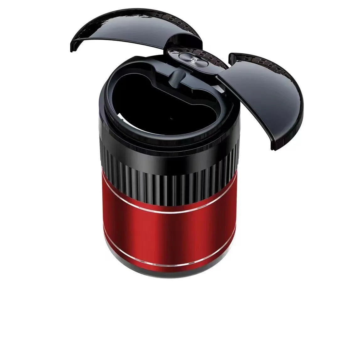 Black smart infrared metal car ashtray with lid on a car dashboard.