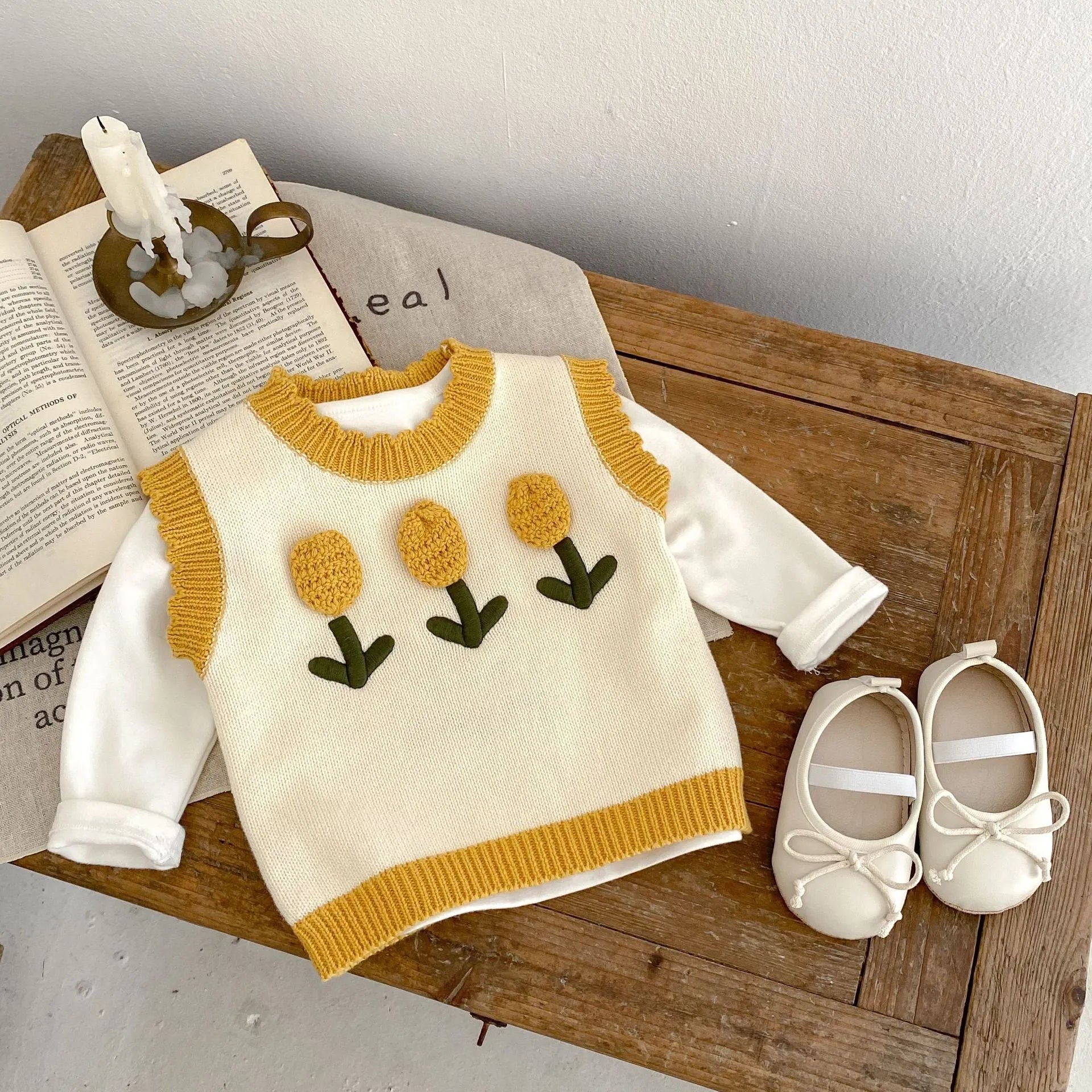 Baby girl sleeveless knitted cotton top with three-dimensional flower in almond white