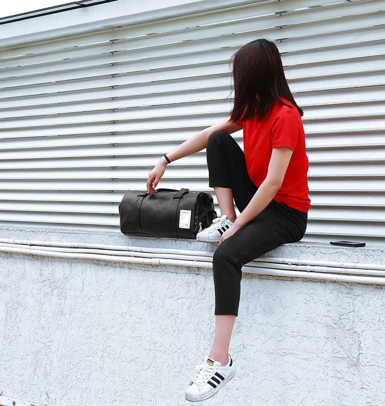 Black waterproof sports bag with separate side shoe compartments shown in large and small sizes.