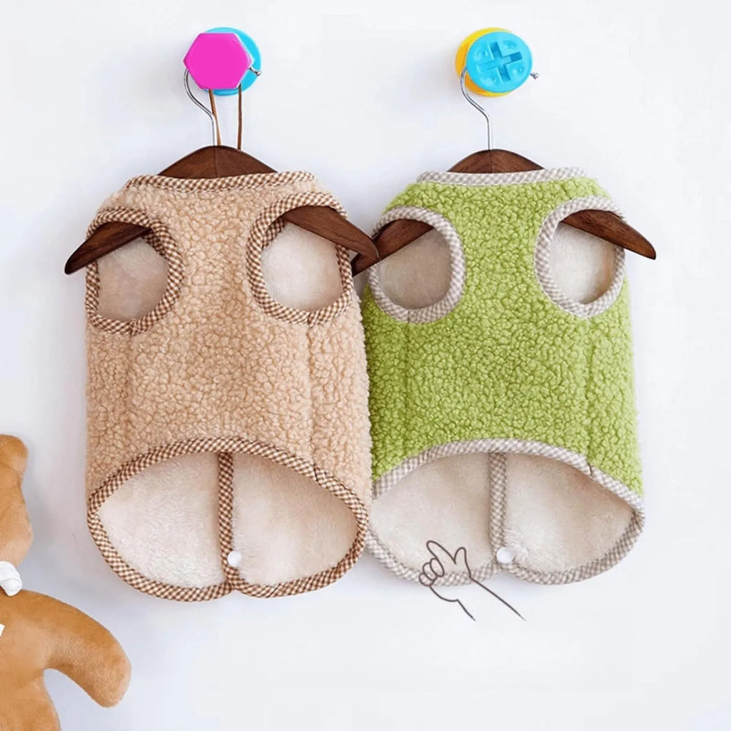 Green coral fleece dog vest with a metal leash ring on the back, shown on a small dog.