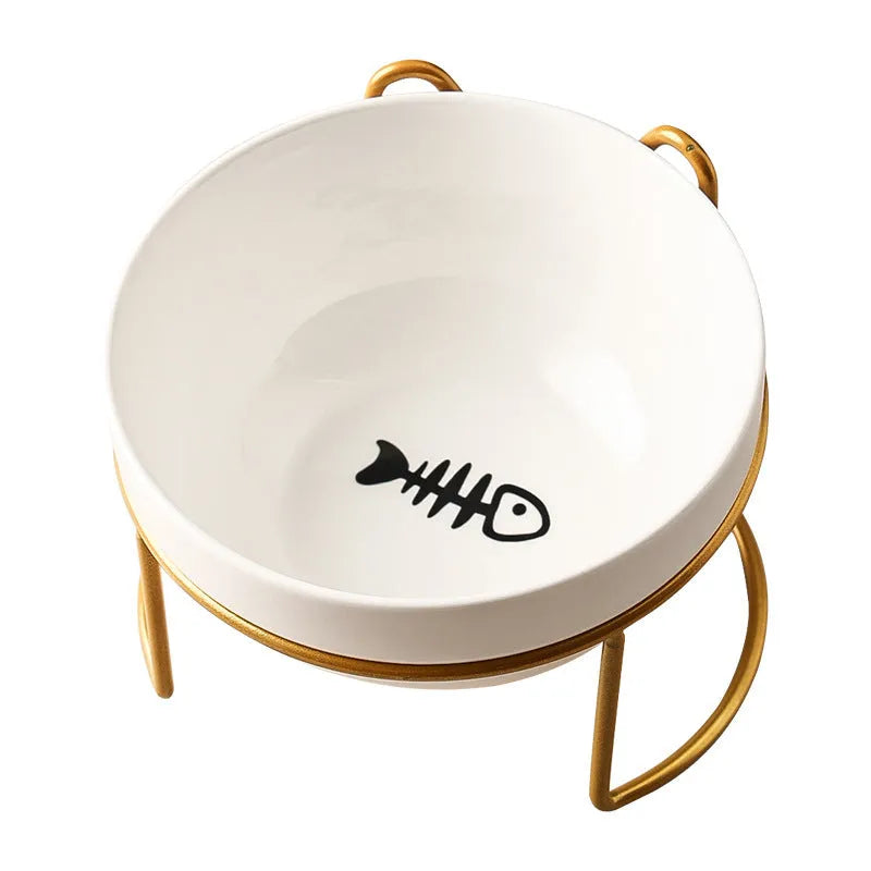 White ceramic pet bowl with cat footprints design in a black iron frame.