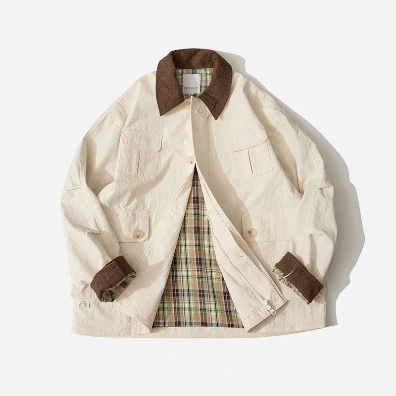 Green casual polyester jacket for men and women with side seam pockets on a hanger