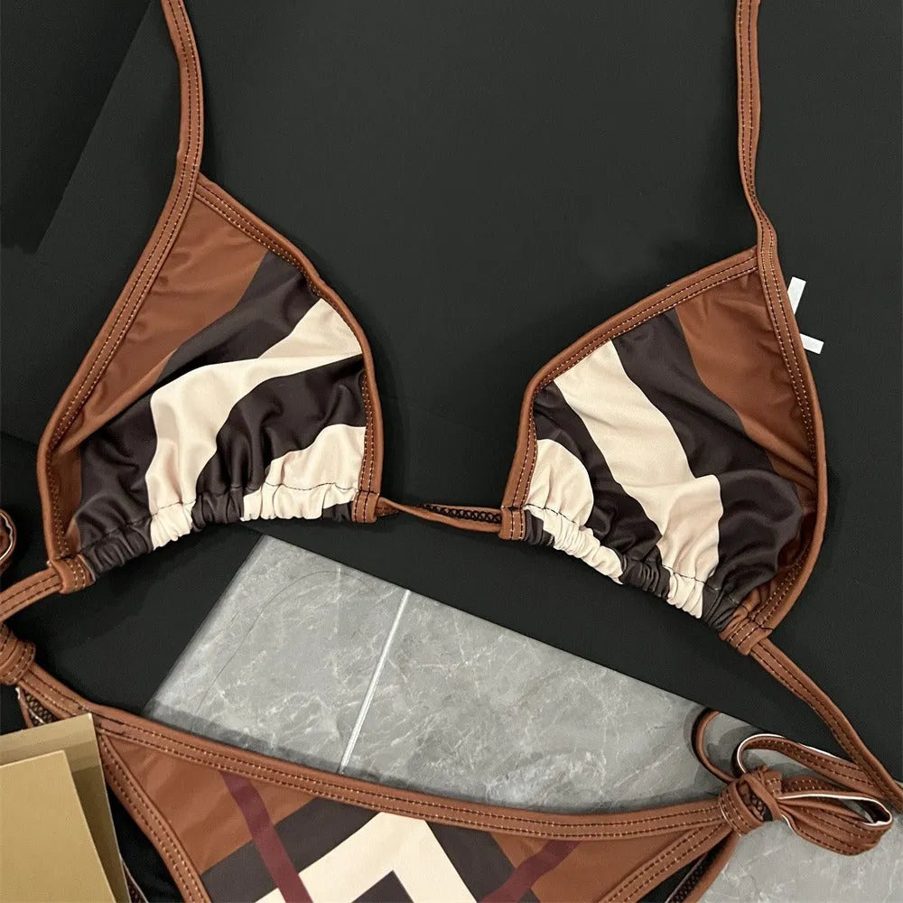 Women's black and white floral bikini set made from polyester fibre, available in sizes S M L XL