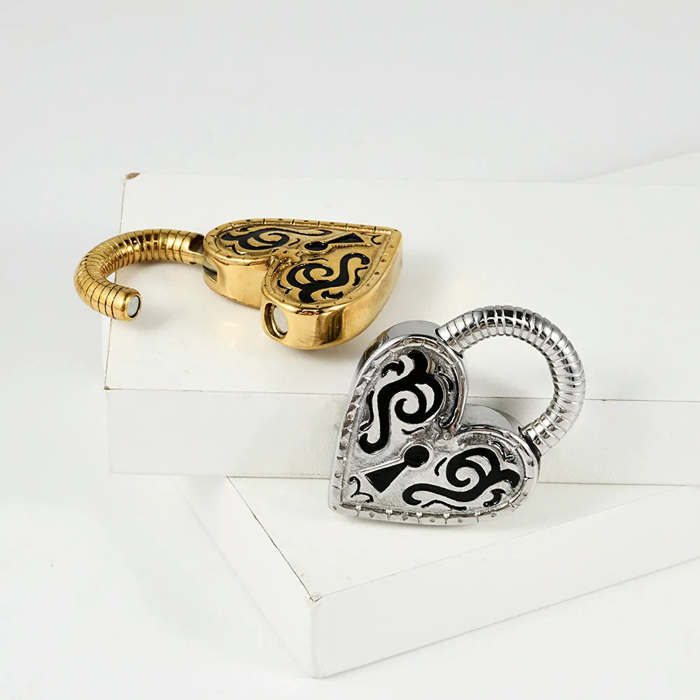 Close-up of a women's stainless steel heart-shaped earring with a gold electroplated finish.