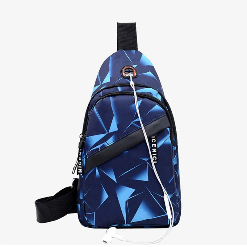 Men's blue Oxford cloth crossbody sling bag showing earphone hole and front zipper.