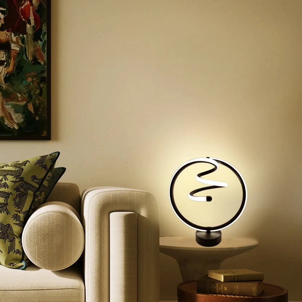 Black musical note shaped Bluetooth light with remote control on a bedside table.
