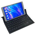 Black folding Bluetooth keyboard for tablets with aluminium bottom cover in open position