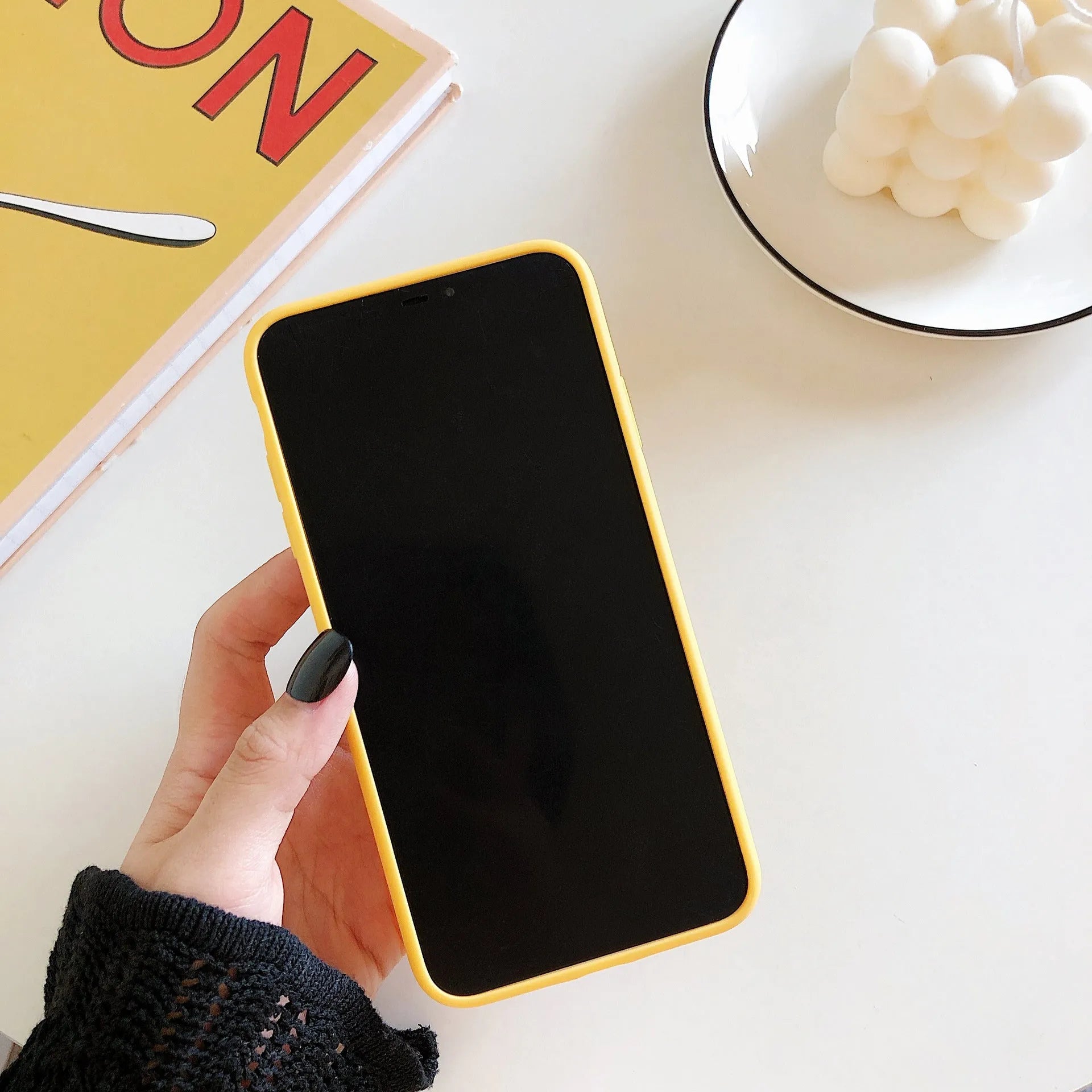 Creative Personality Squeeze The Banana design on a yellow hard back cover for an iPhone.