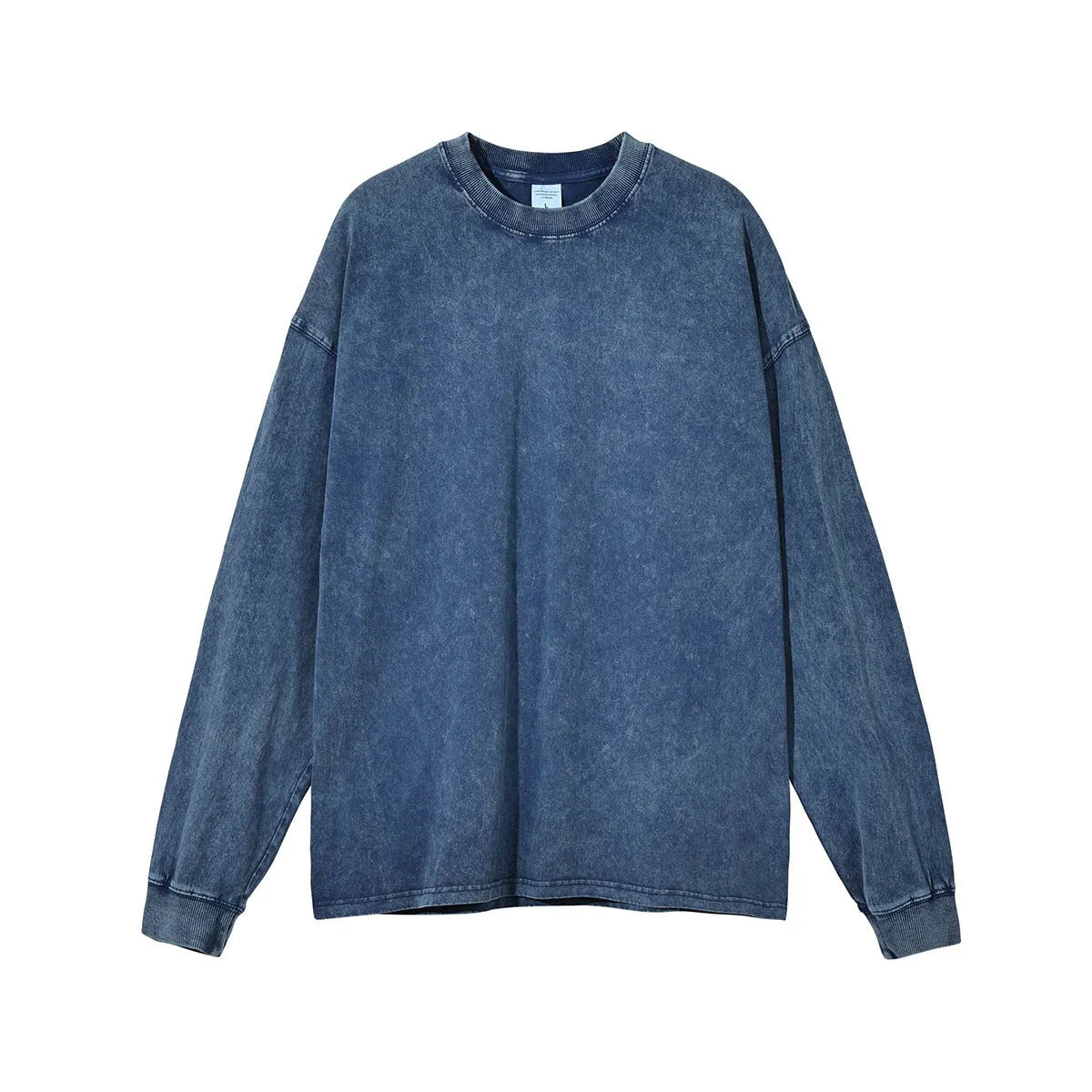 Man wearing a washed vintage style loose long sleeve cotton pullover shirt in a batik colour.