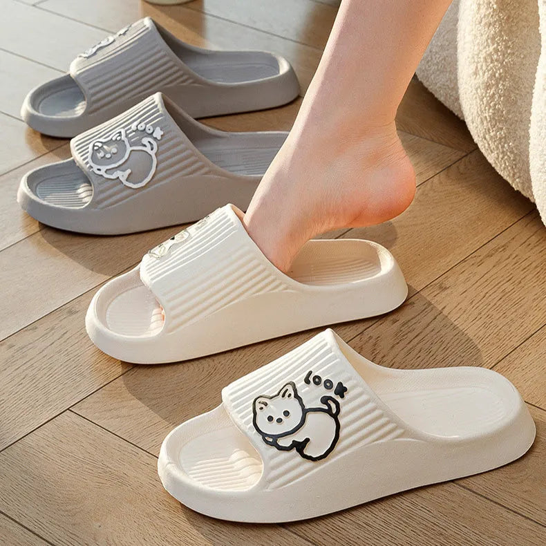 Women's pink cat-themed flip-flop slippers with a thick light blue EVA platform sole.