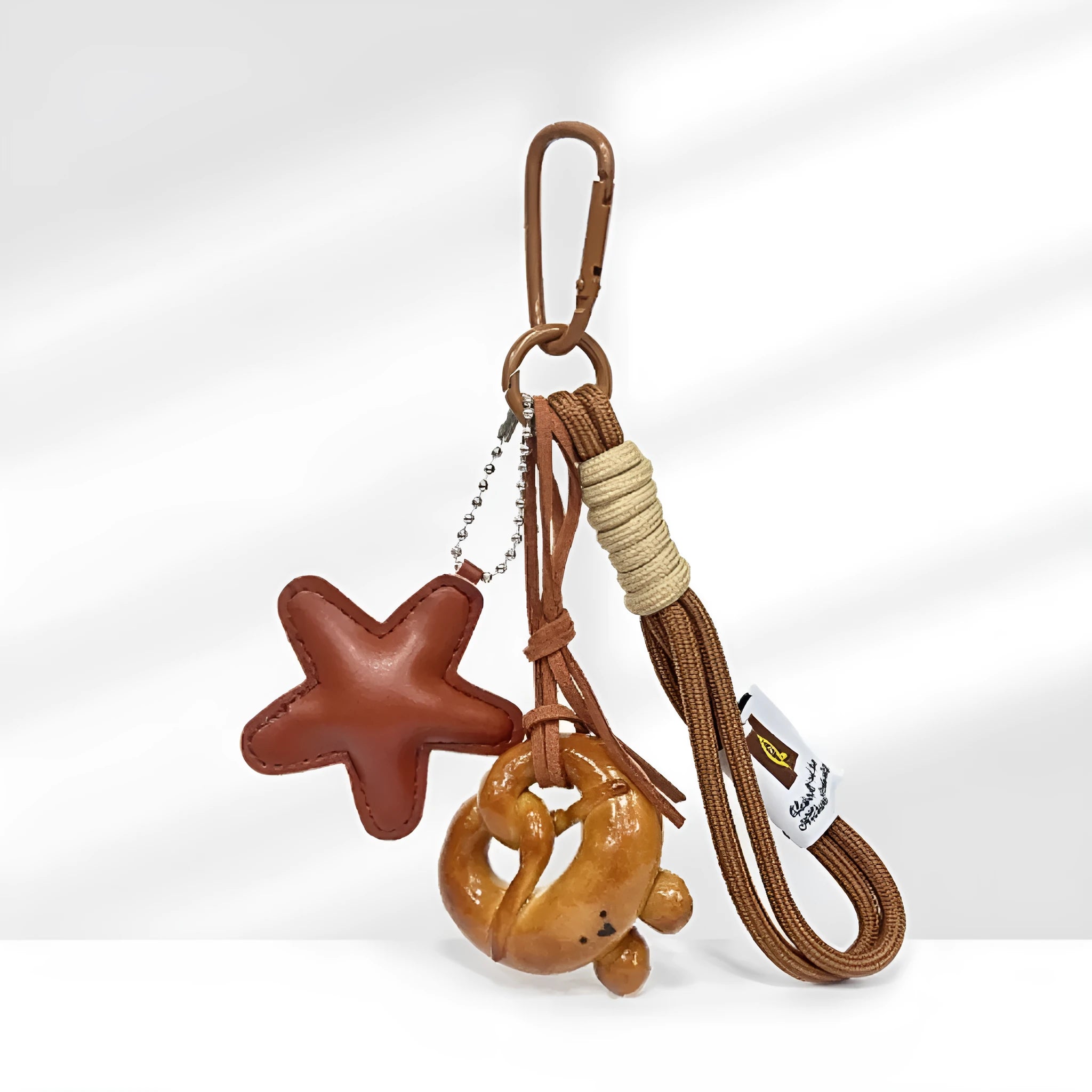 Handmade soda bread handbag pendant with brown star details and carrying strap