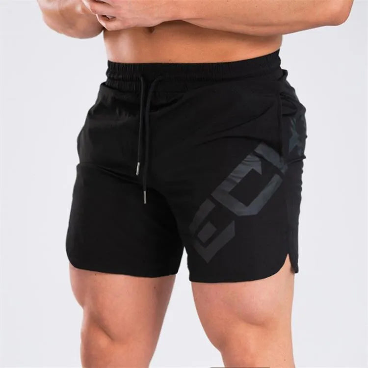 Men's black elastic running shorts with a mid-waist and knee-length cut on a plain background.