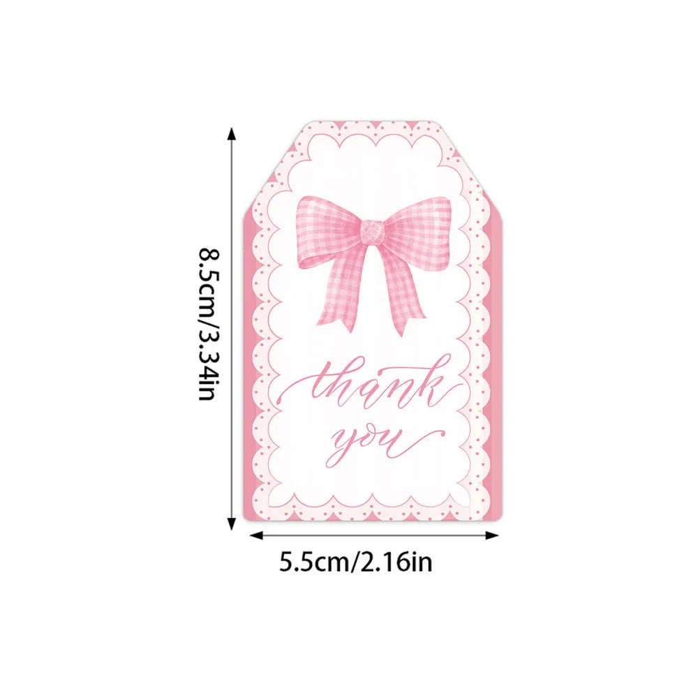Set of 60 decorative bowknot-shaped paper gift tags with natural jute twine for birthdays.