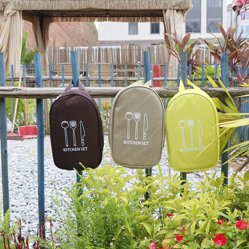 Picnic storage bag containing 12 stainless steel utensils for outdoor meals.