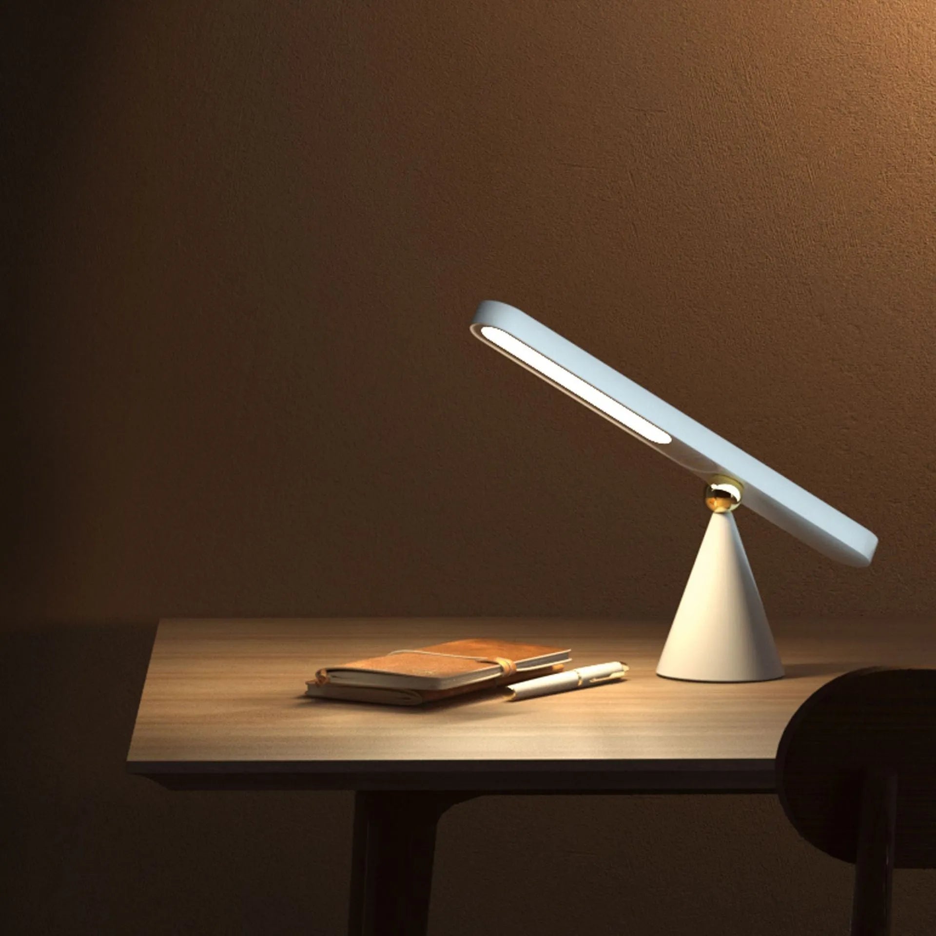 Geometric wireless table lamp with magnetic suction on metal surface showing USB connection