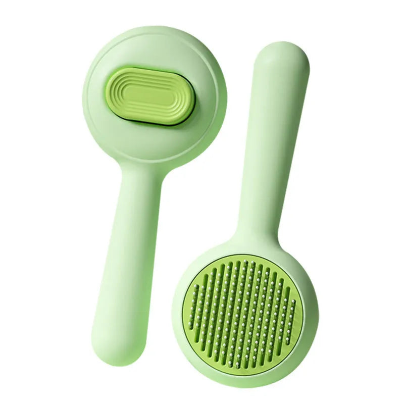 Cat grooming brush with stainless steel teeth and non-slip handle in green and yellow colour options