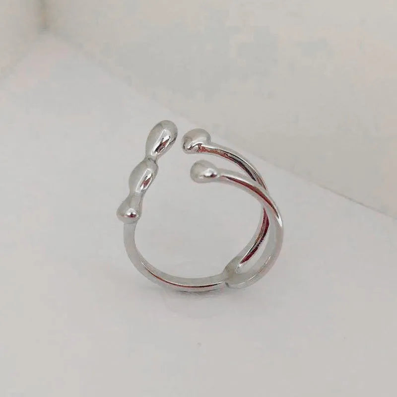 Adjustable open ring for women in brass with circular sphere design, gold or silver finish