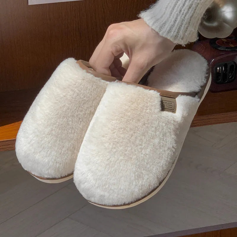 Blue PVC plush slipper with non-slip sole and car stitching detail on upper.