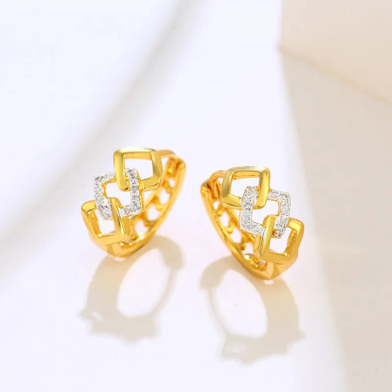 Gold geometric hollow-out earrings with colour separation detail on ear clips