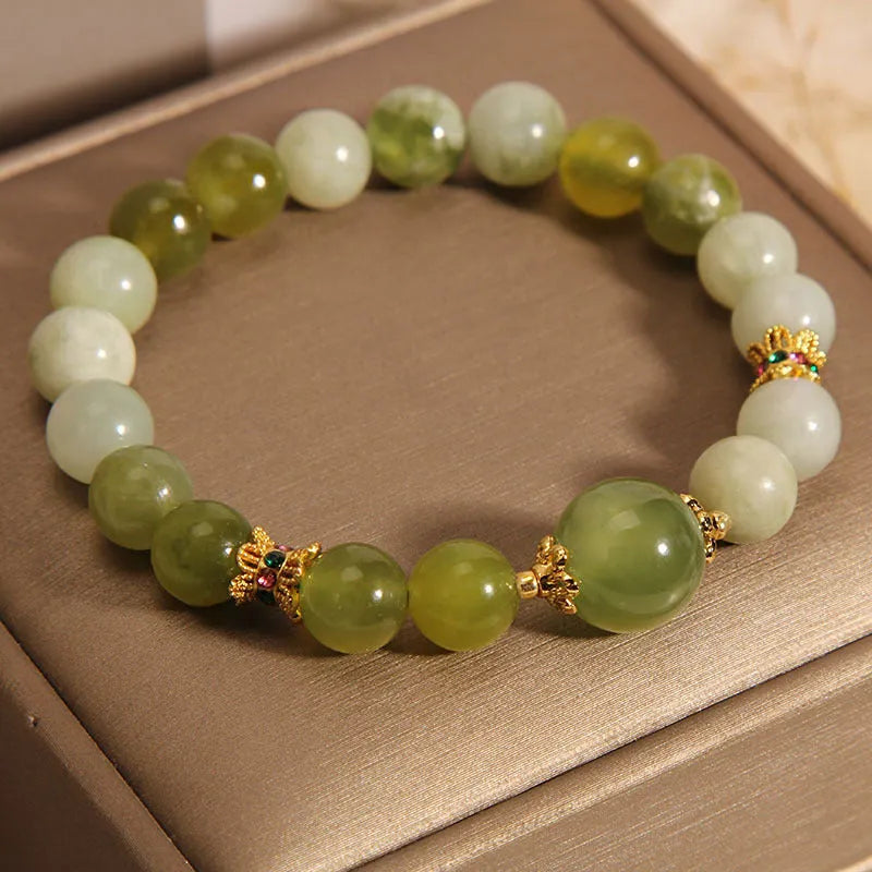 Women's bracelet made of green Xiuyan jade in an original sweet Mori style design.