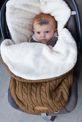 Envelope-style baby stroller sleeping bag in a choice of colours with cotton wool filling.