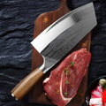 A stainless steel kitchen knife with a 320mm blade on a kitchen counter.