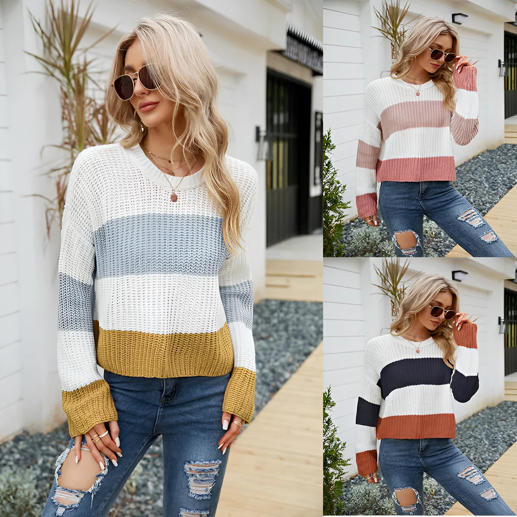 Women's short striped loose pullover sweater in acrylic fabric on a hanger.