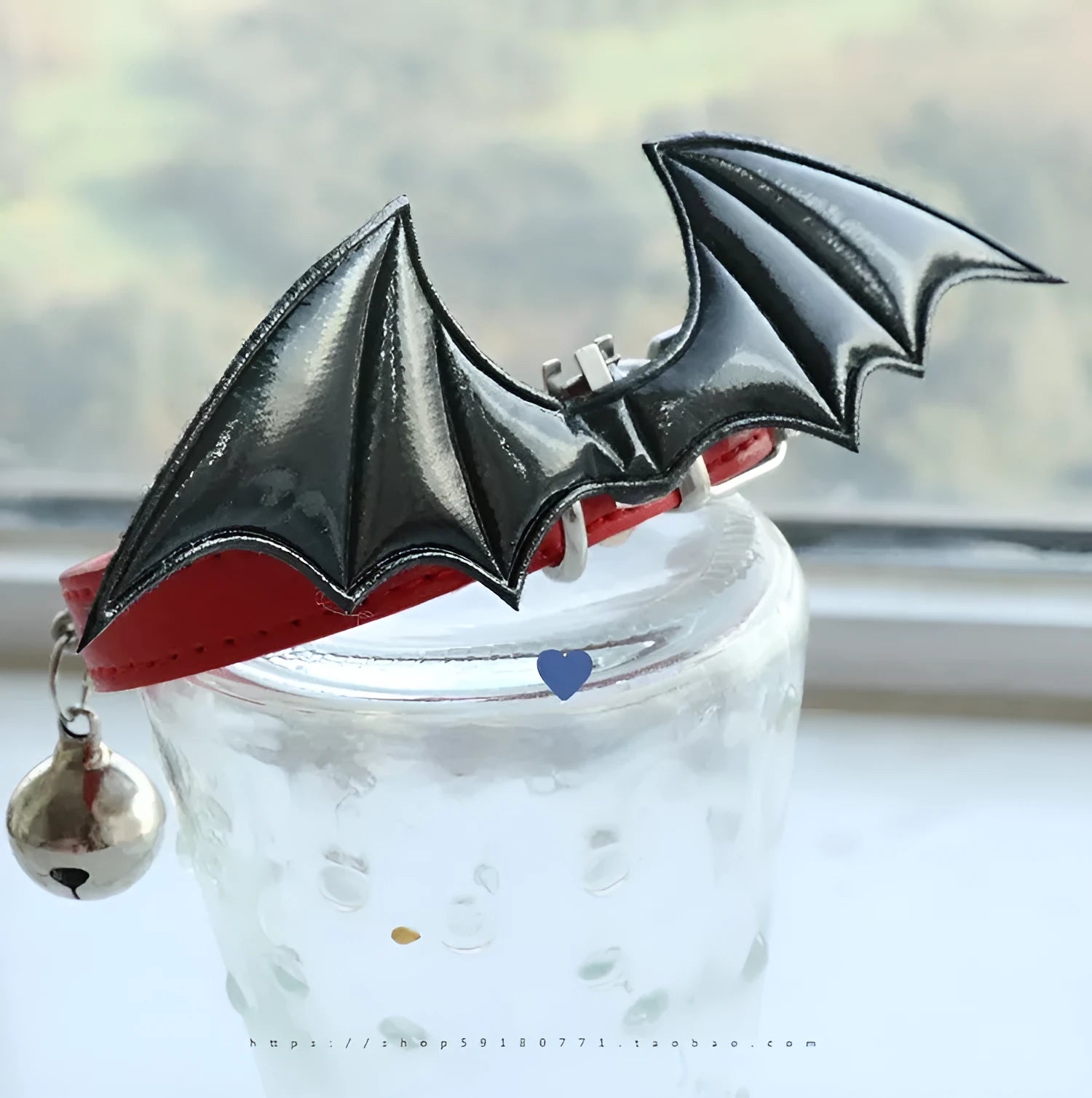 Small dog collar with devil wings and bell detail in patent leather satin material