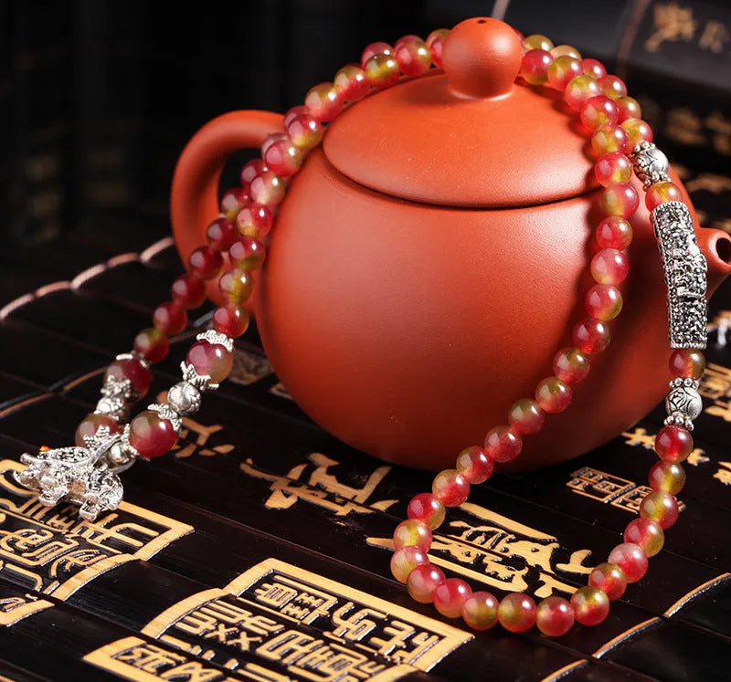 Natural watermelon crystal bracelet with Chinese knot design in 6mm and 8mm bead sizes
